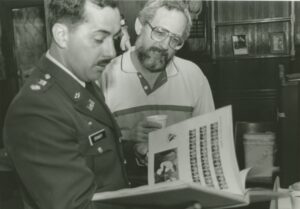 Elray Grmmoff (left) is holding a yearbook with Edward Barrese Class of 1969