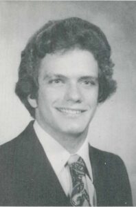 Charles Daniel is pictured in a suit and tie for his senior yearbook photo